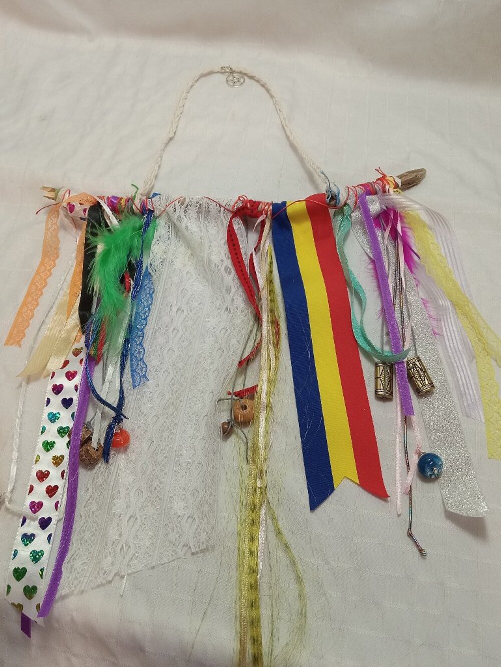 Handcrafted artistic banner made from treated driftwood, ribbons & decorations
